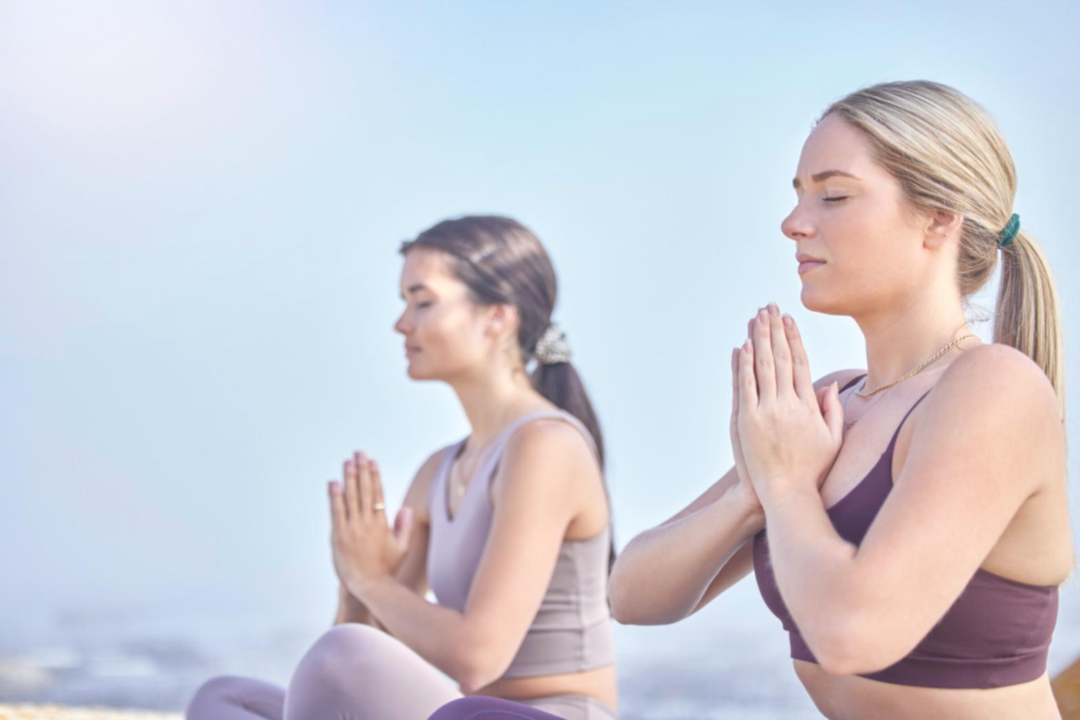 Close-up of yoga pose demonstration showing proper hand placement